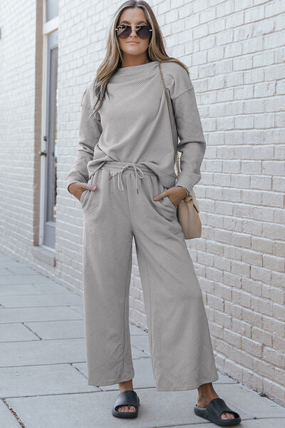 Double Take Full Size Textured Long Sleeve Top and Drawstring Pants set in a stylish design, showcasing the texture and drawstring feature.
