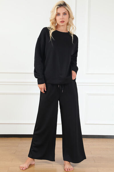 Double Take Full Size Textured Long Sleeve Top and Drawstring Pants set in a stylish design, showcasing the texture and drawstring feature.