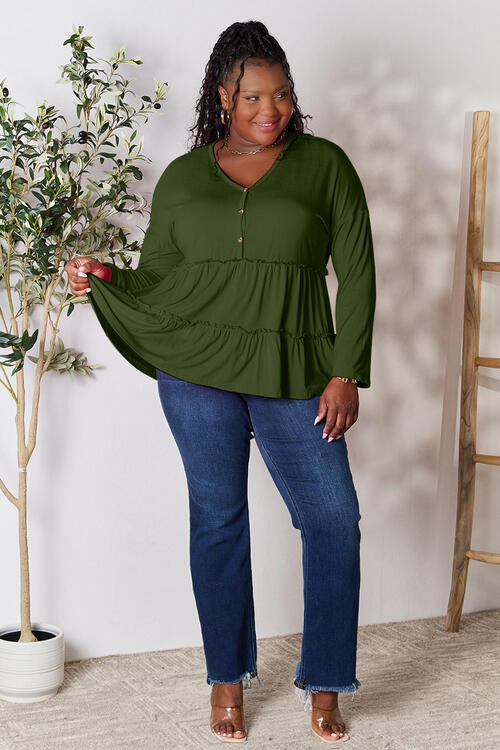 Double Take Half Button Long Sleeve Ruffle Hem Blouse in a stylish design with ruffle hem and half-button closure.