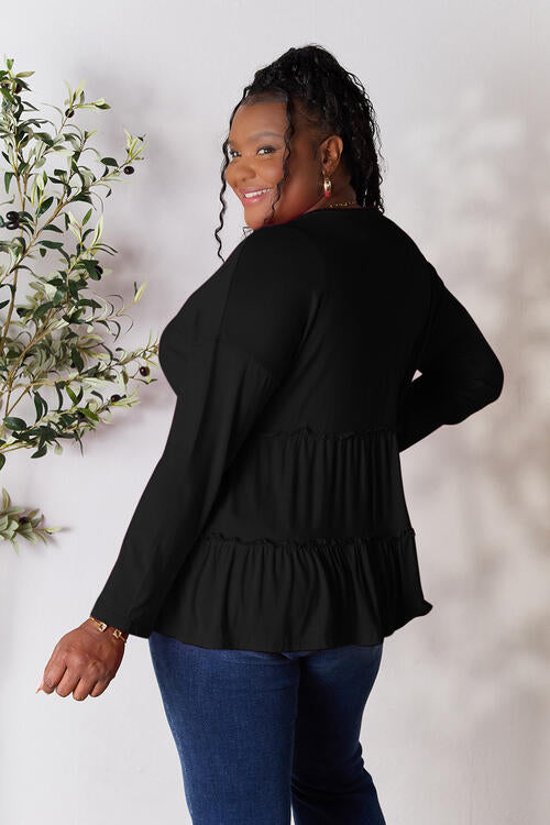 Double Take Half Button Long Sleeve Ruffle Hem Blouse in a stylish design with ruffle hem and half-button closure.