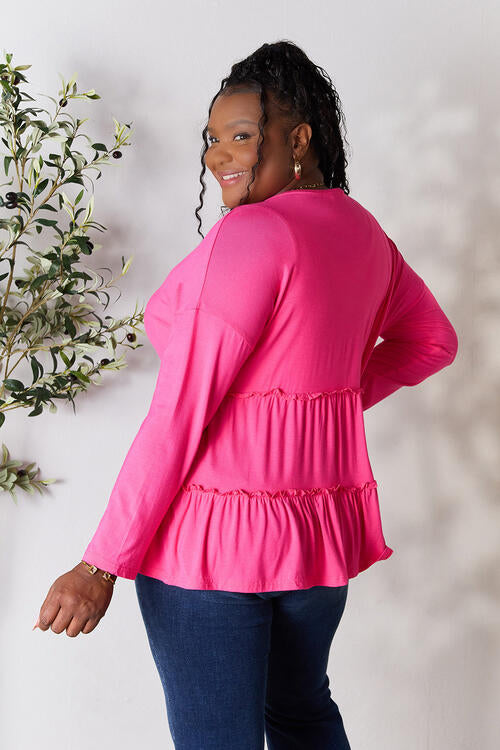 Double Take Half Button Long Sleeve Ruffle Hem Blouse in a stylish design with ruffle hem and half-button closure.