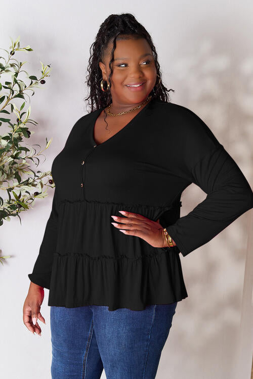 Double Take Half Button Long Sleeve Ruffle Hem Blouse in a stylish design with ruffle hem and half-button closure.