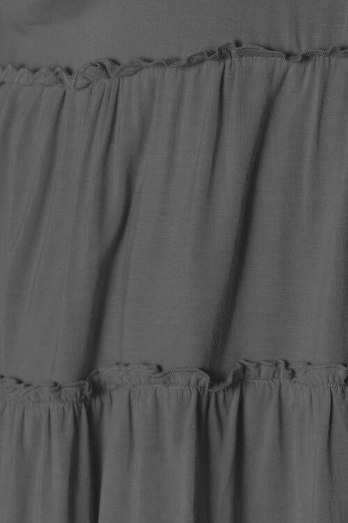 Double Take Half Button Long Sleeve Ruffle Hem Blouse in a stylish design with ruffle hem and half-button closure.