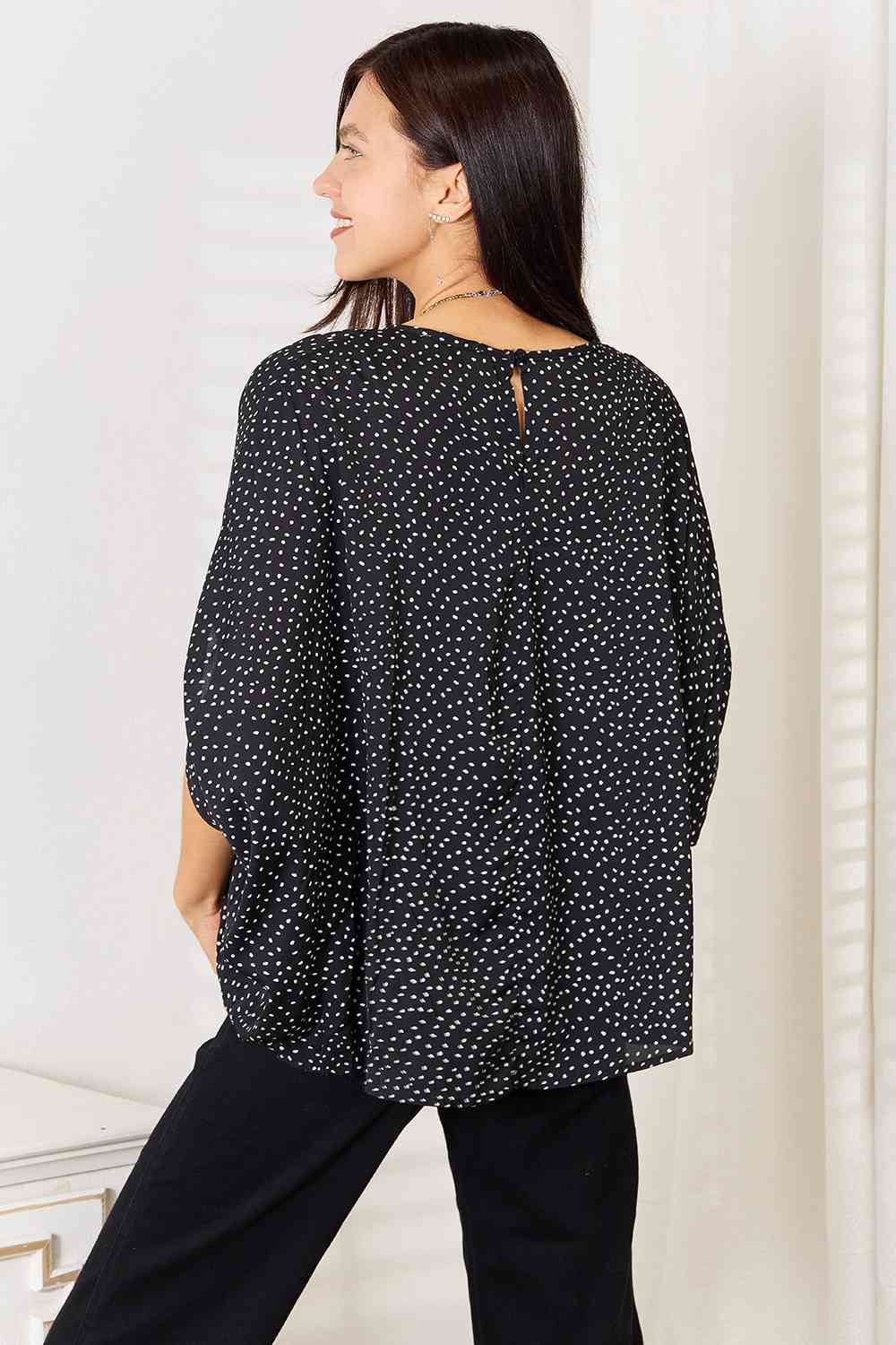 Double Take Printed Dolman Sleeve Round Neck Blouse featuring a stylish print and comfortable dolman sleeves, perfect for casual or dressy occasions.