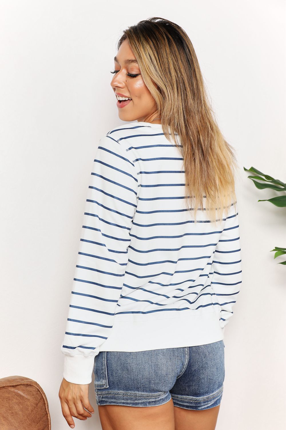 Double Take Striped Long Sleeve Round Neck Top featuring a classic round neckline and chic striped pattern.