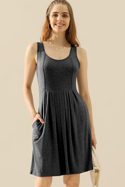Doublju Full Size Round Neck Ruched Sleeveless Dress in a stylish design with pockets, showcasing its flattering silhouette and comfortable fabric.
