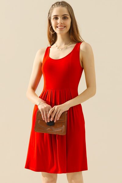 Doublju Full Size Round Neck Ruched Sleeveless Dress in a stylish design with pockets, showcasing its flattering silhouette and comfortable fabric.