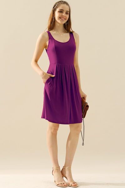 Doublju Full Size Round Neck Ruched Sleeveless Dress in a stylish design with pockets, showcasing its flattering silhouette and comfortable fabric.