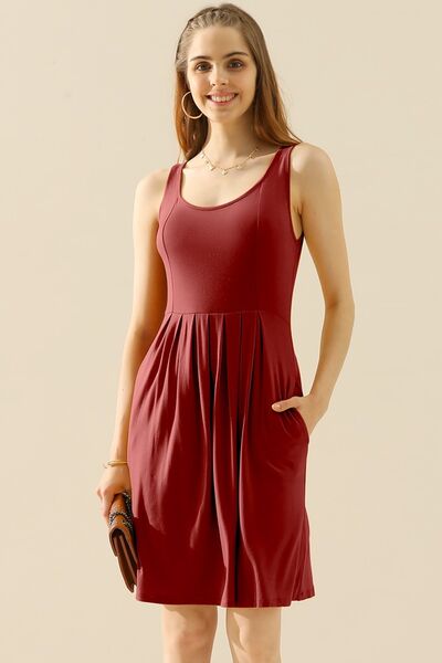 Doublju Full Size Round Neck Ruched Sleeveless Dress in a stylish design with pockets, showcasing its flattering silhouette and comfortable fabric.