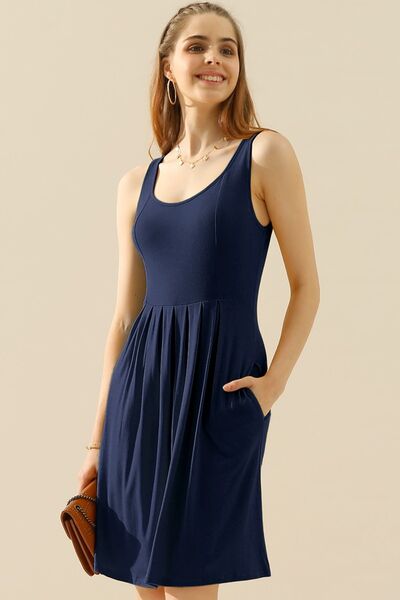 Doublju Full Size Round Neck Ruched Sleeveless Dress in a stylish design with pockets, showcasing its flattering silhouette and comfortable fabric.