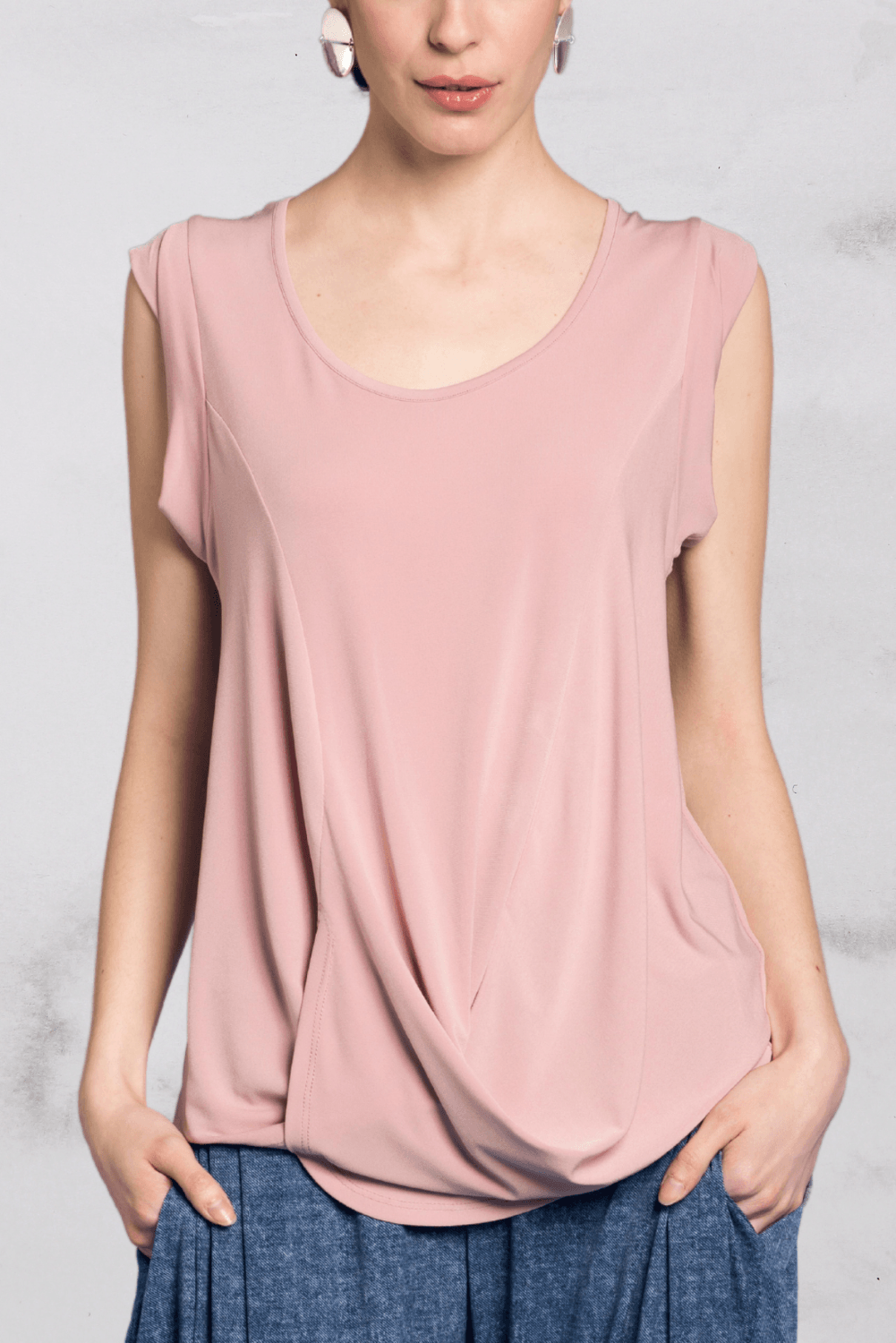 A stylish Drape Top featuring cap sleeves, made from a soft polyester and spandex blend, perfect for versatile styling.