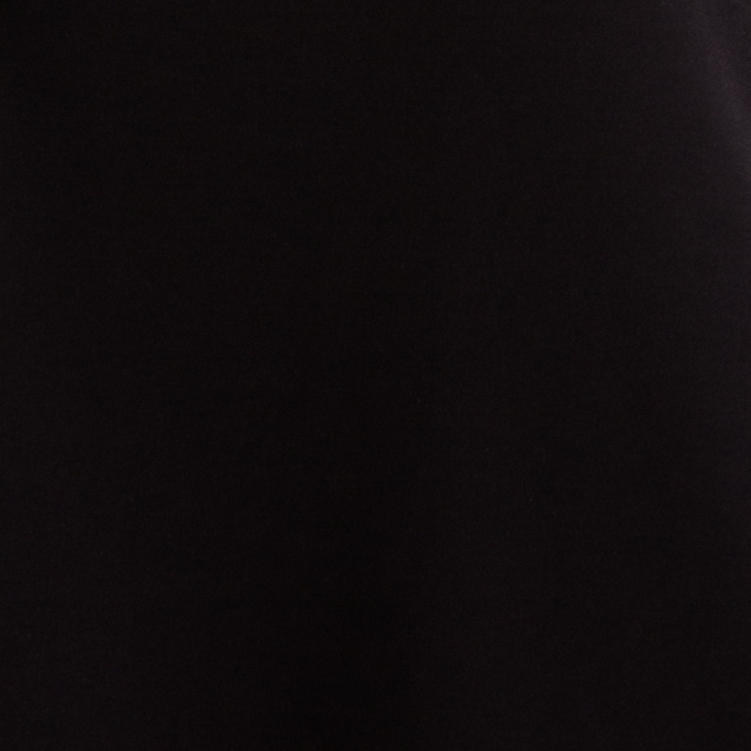 A stylish Drape Top featuring cap sleeves, made from a soft polyester and spandex blend, perfect for versatile styling.