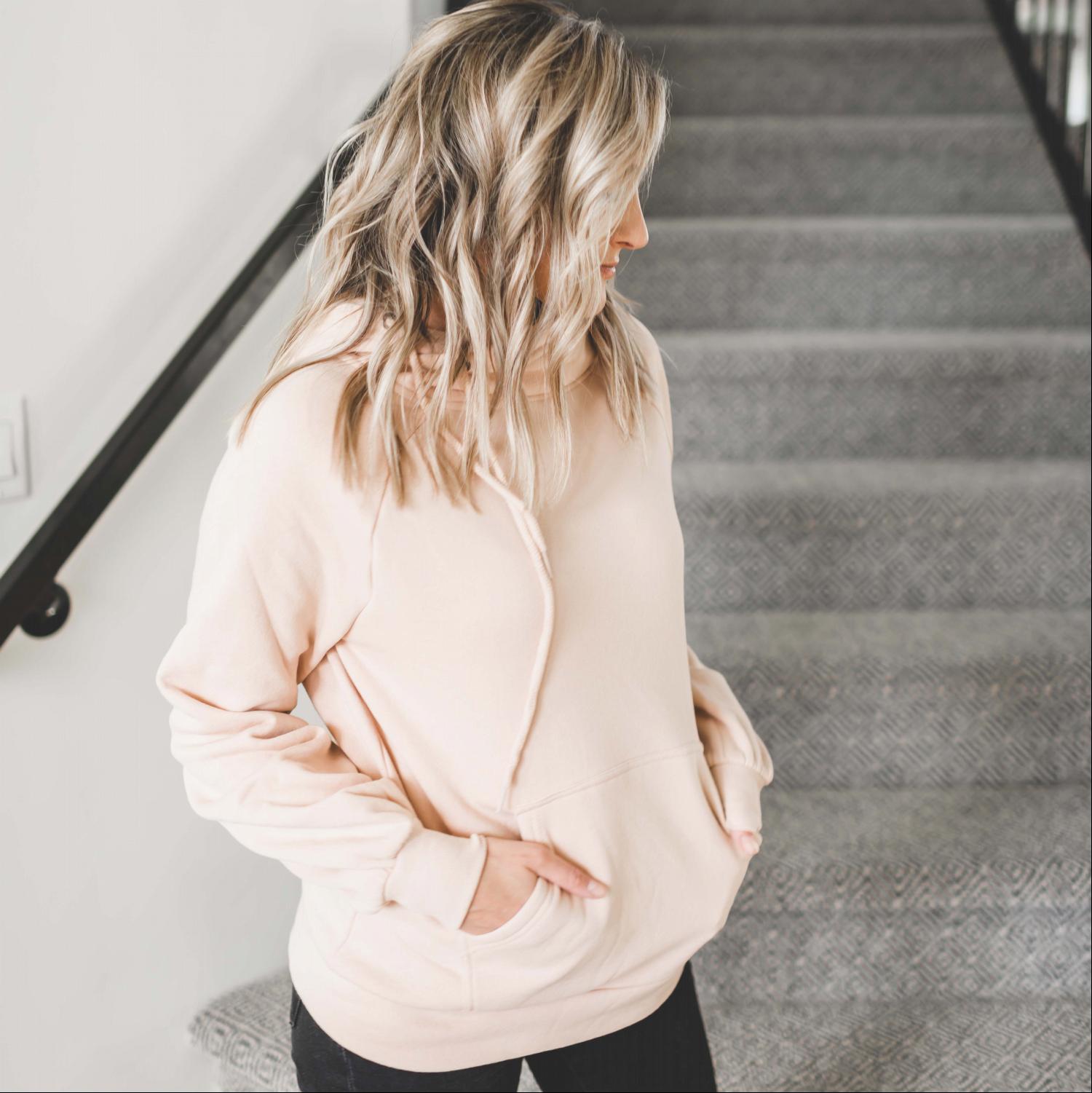 Cozy drawstring hoodie sweatshirt with pockets, featuring a deep cowl neckline and adjustable drawstrings, perfect for lounging.