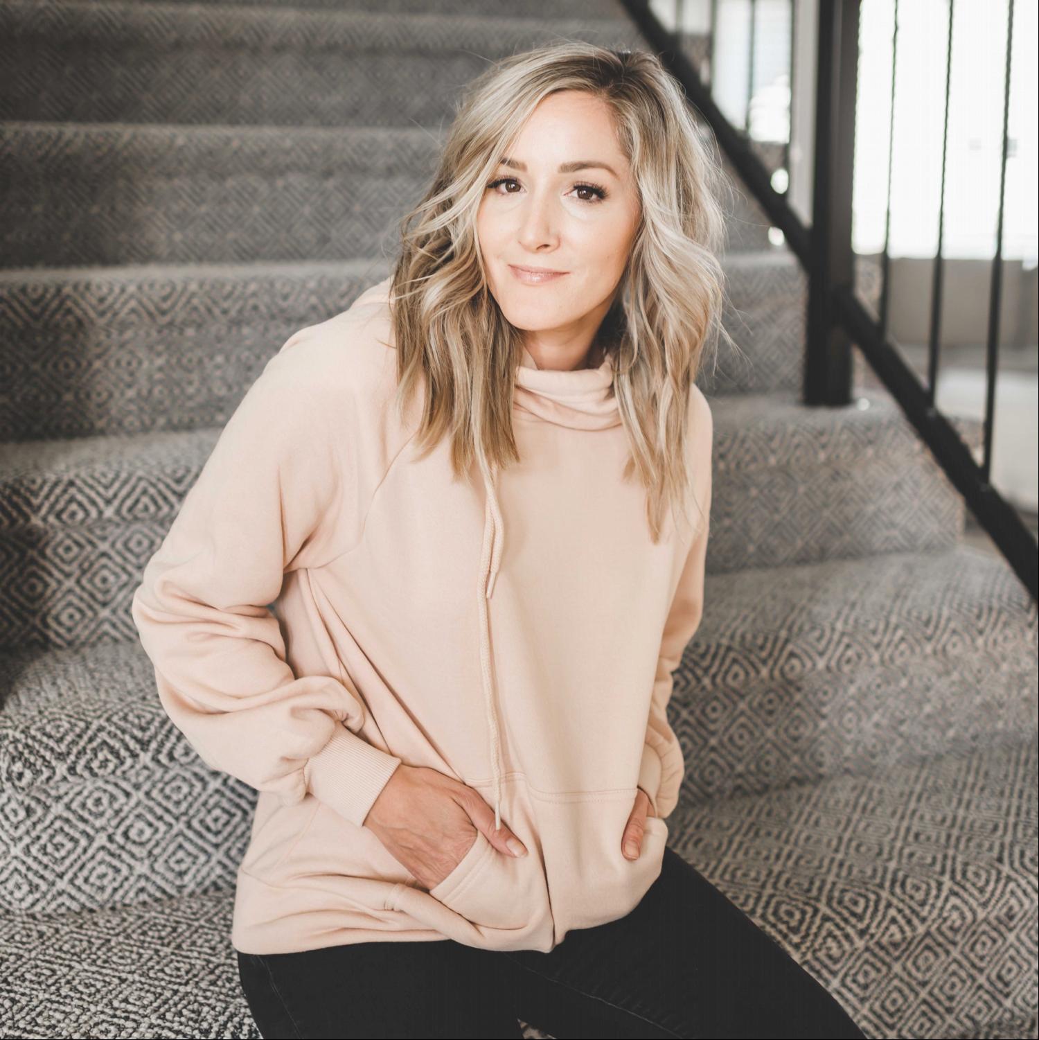 Cozy drawstring hoodie sweatshirt with pockets, featuring a deep cowl neckline and adjustable drawstrings, perfect for lounging.