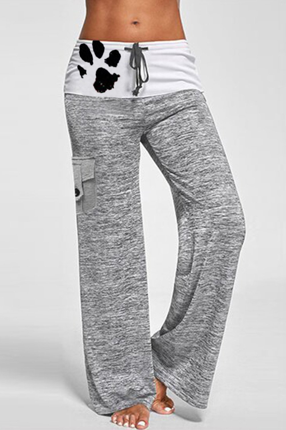 A pair of stylish drawstring pockets stretch wide leg yoga pants featuring a mid-rise waistband, leopard print accents, and multiple pockets.