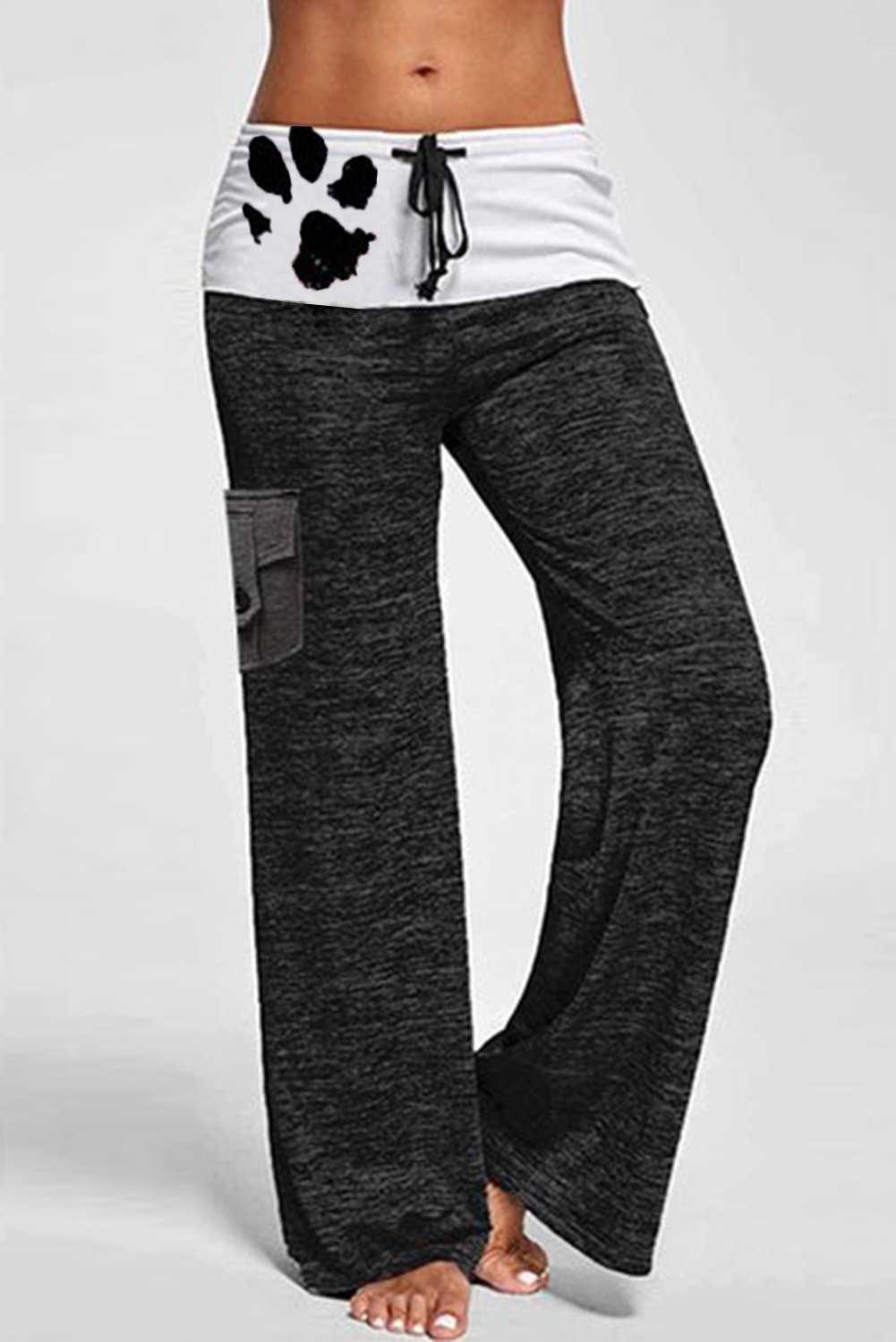 A pair of stylish drawstring pockets stretch wide leg yoga pants featuring a mid-rise waistband, leopard print accents, and multiple pockets.