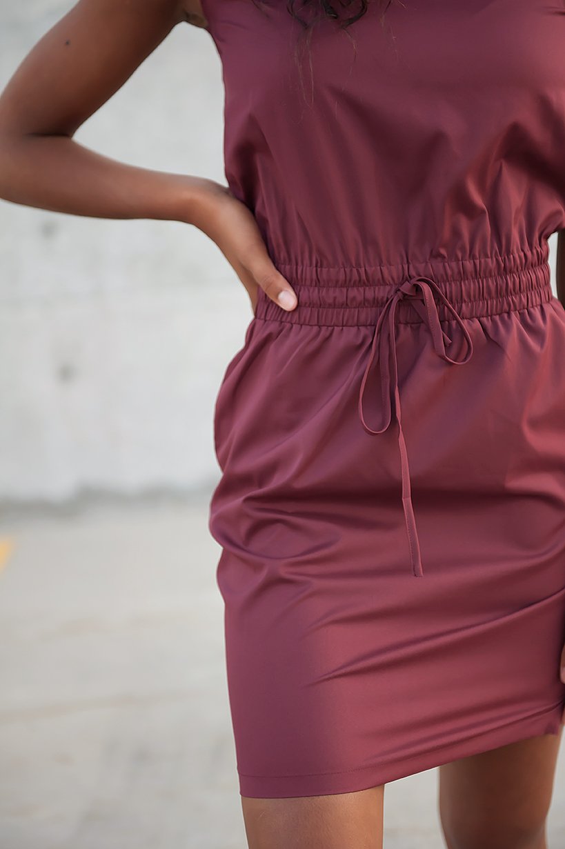 DT Women's DOWNTOWN Lightweight Dress in Burgundy with cap sleeves and pockets, showcasing its elegant design and adjustable waistband.