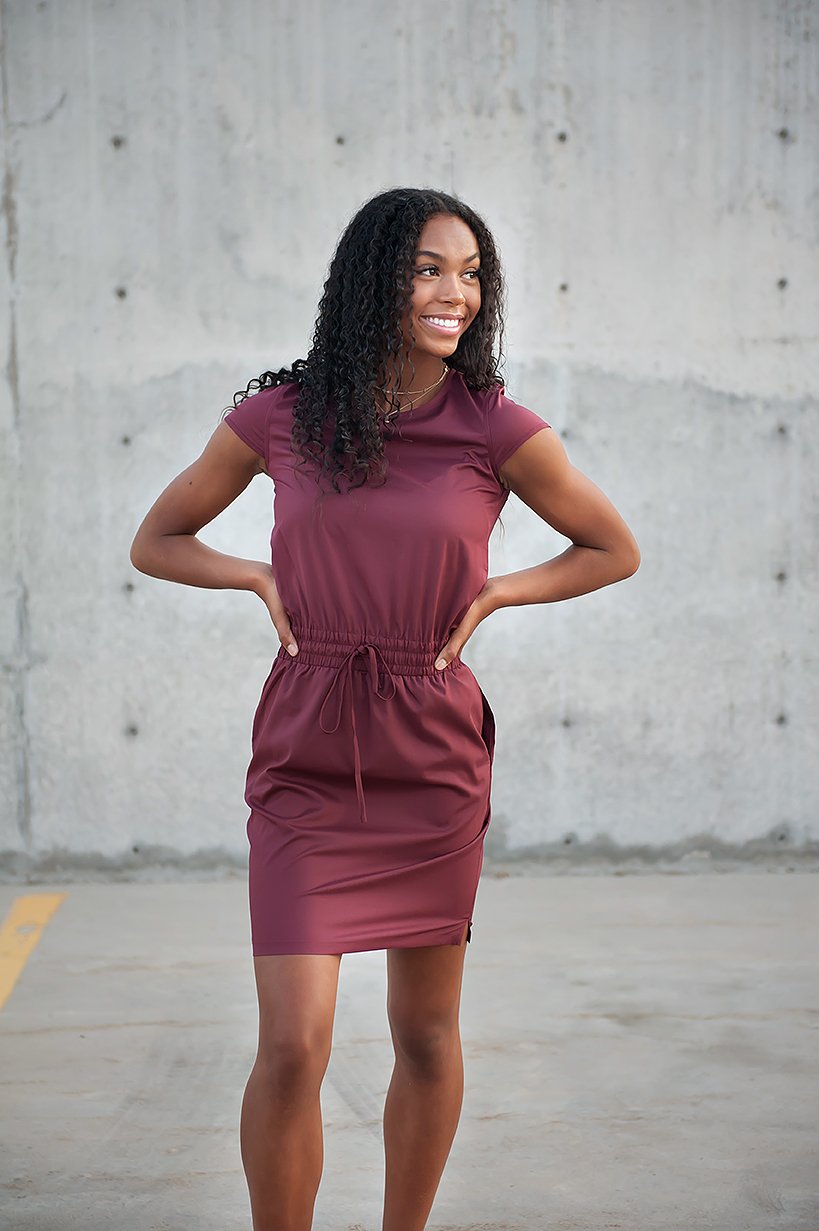 DT Women's DOWNTOWN Lightweight Dress in Burgundy with cap sleeves and pockets, showcasing its elegant design and adjustable waistband.