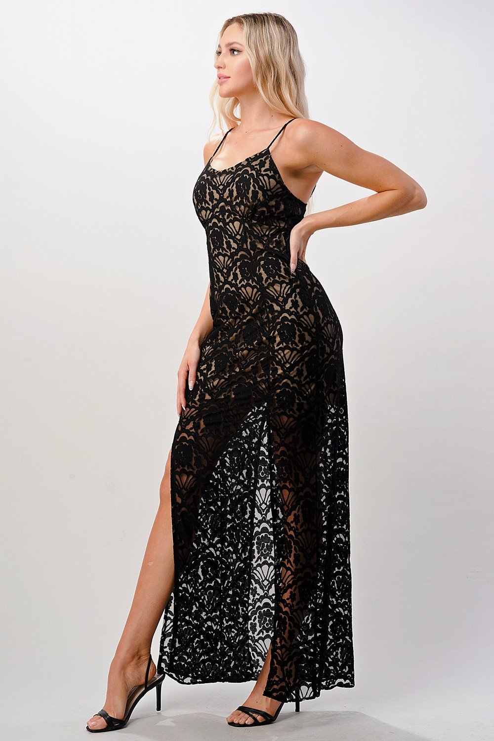 Elegant black lace maxi dress featuring a side slit, perfect for formal occasions.