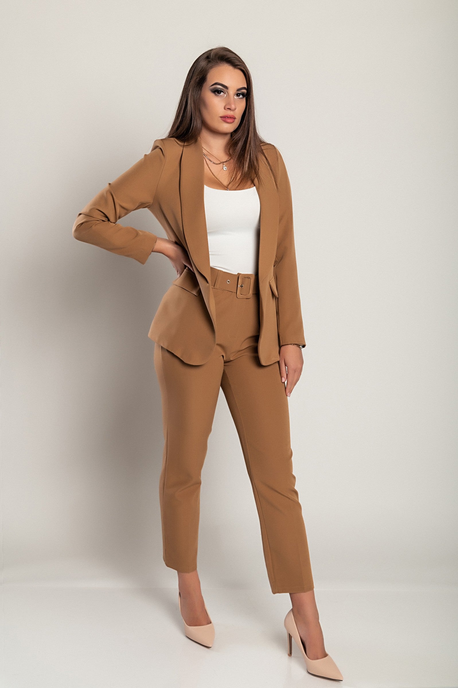 Elegant camel blazer and pants set featuring long sleeves, classic collar, and attached belt, made in Italy.