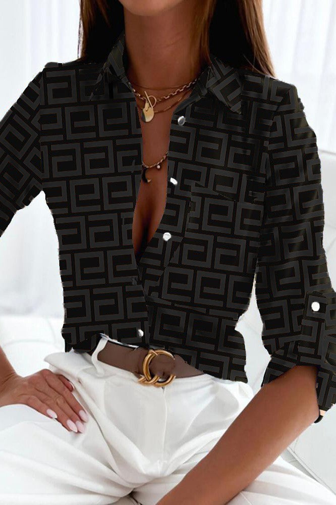 Elegant black blouse by Lavlenta featuring a trendy geometric print, classic collar, and long sleeves.