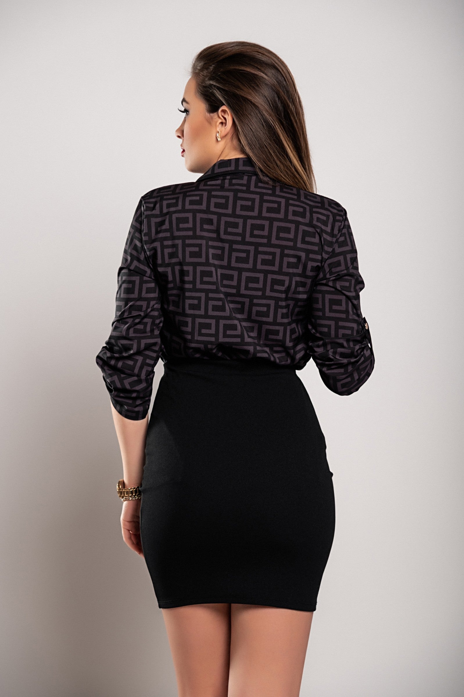 Elegant black blouse by Lavlenta featuring a trendy geometric print, classic collar, and long sleeves.