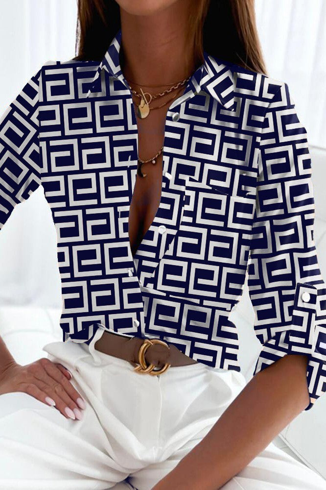 Elegant dark blue blouse with geometric print, featuring a classic collar and long sleeves, made of high-quality imitation satin.
