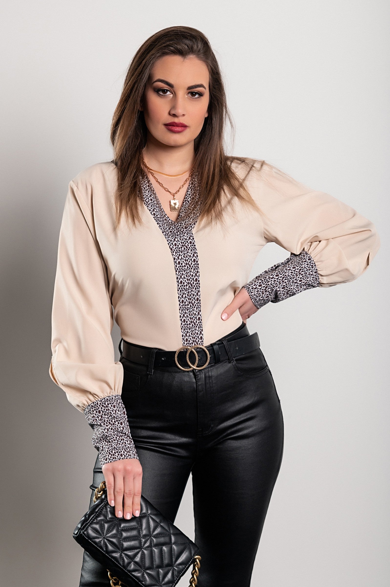 Elegant beige blouse with leopard print, featuring a 'V' neckline and long sleeves, made from high-quality imitation satin.