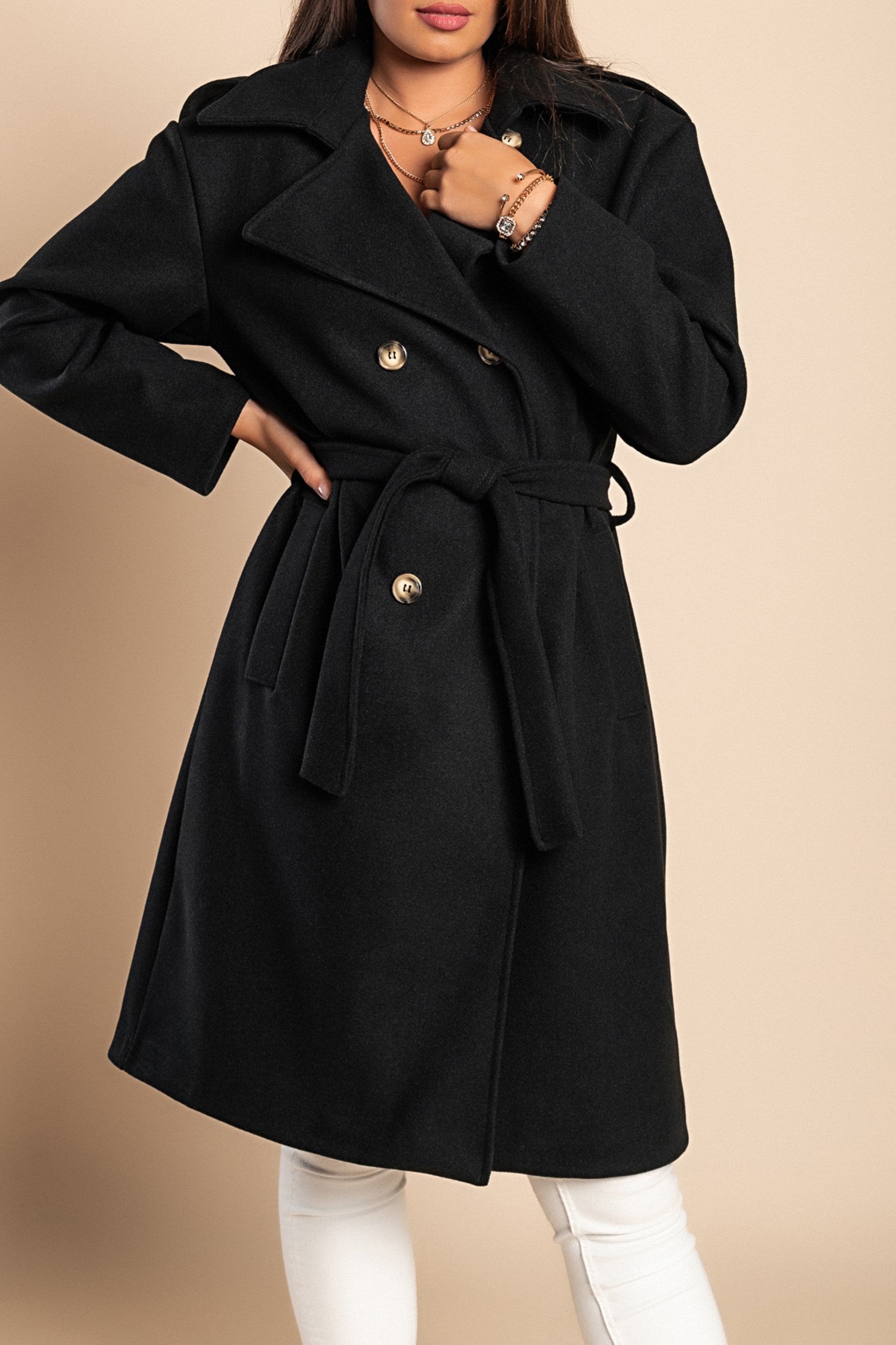 Elegant black coat with buttons, featuring a classic collar, decorative belt, and knee-length design, made from high-quality soft fabric.