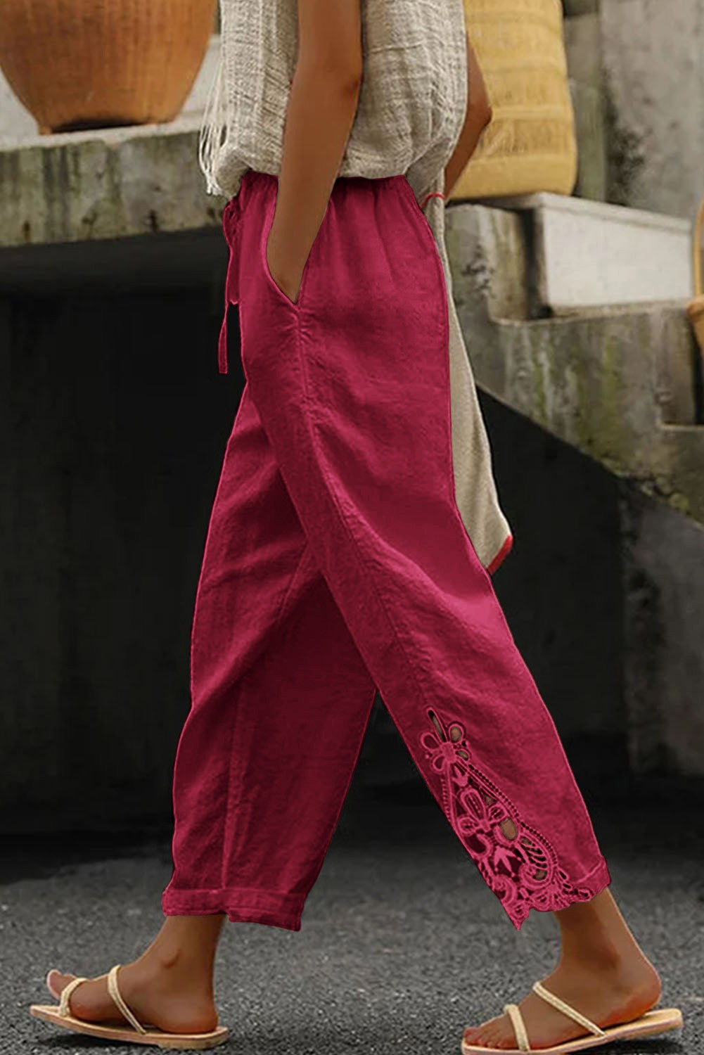 Elegant fuchsia cotton trousers with lace trim, featuring an elastic drawstring waist and 7/8 length design.