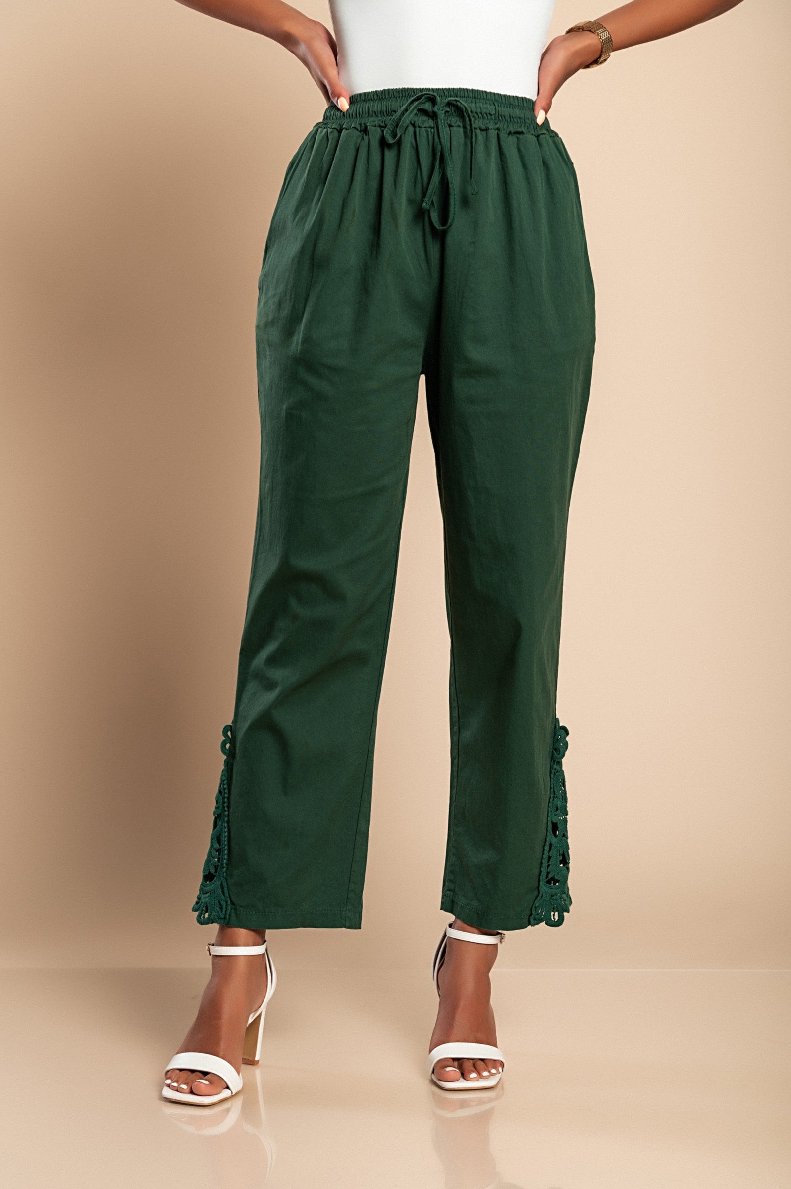 Elegant olive green cotton trousers with lace trim, featuring an elastic drawstring waist and 7/8 length design.