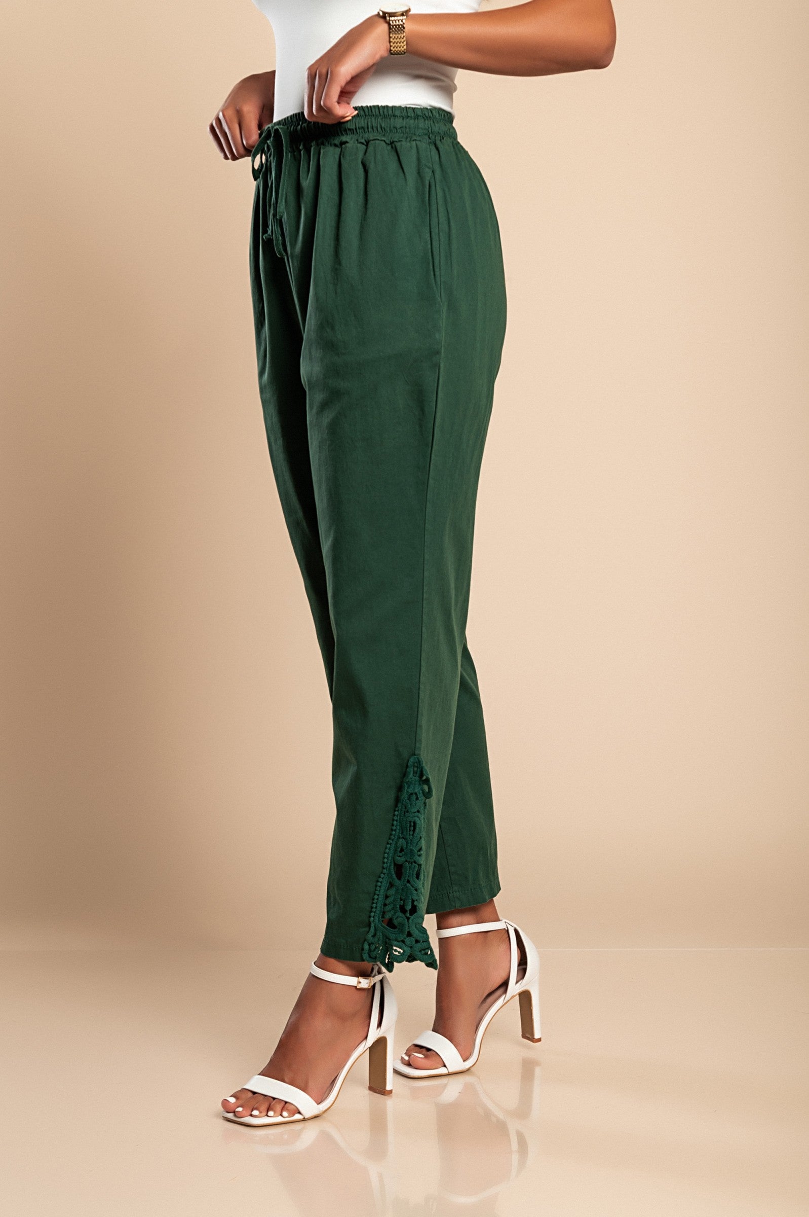 Elegant olive green cotton trousers with lace trim, featuring an elastic drawstring waist and 7/8 length design.