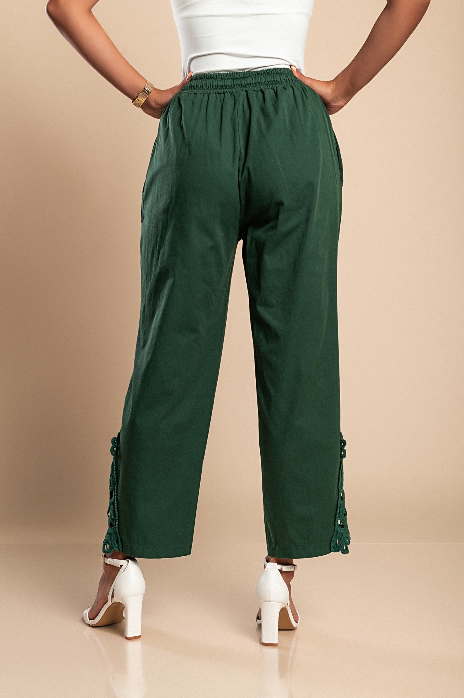 Elegant olive green cotton trousers with lace trim, featuring an elastic drawstring waist and 7/8 length design.