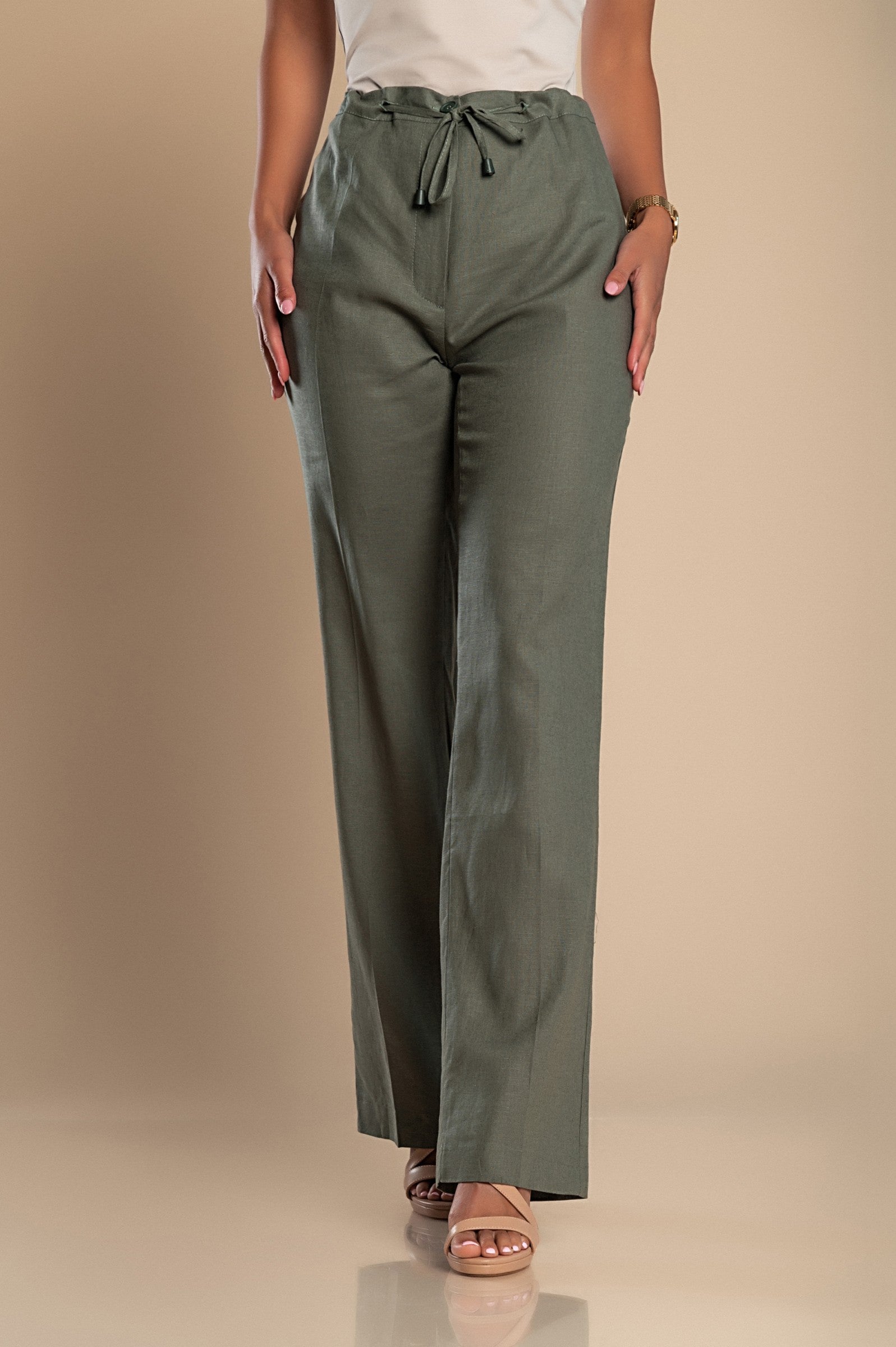 Elegant olive green linen trousers with a straight cut, featuring a drawstring waist and elastic back for comfort.