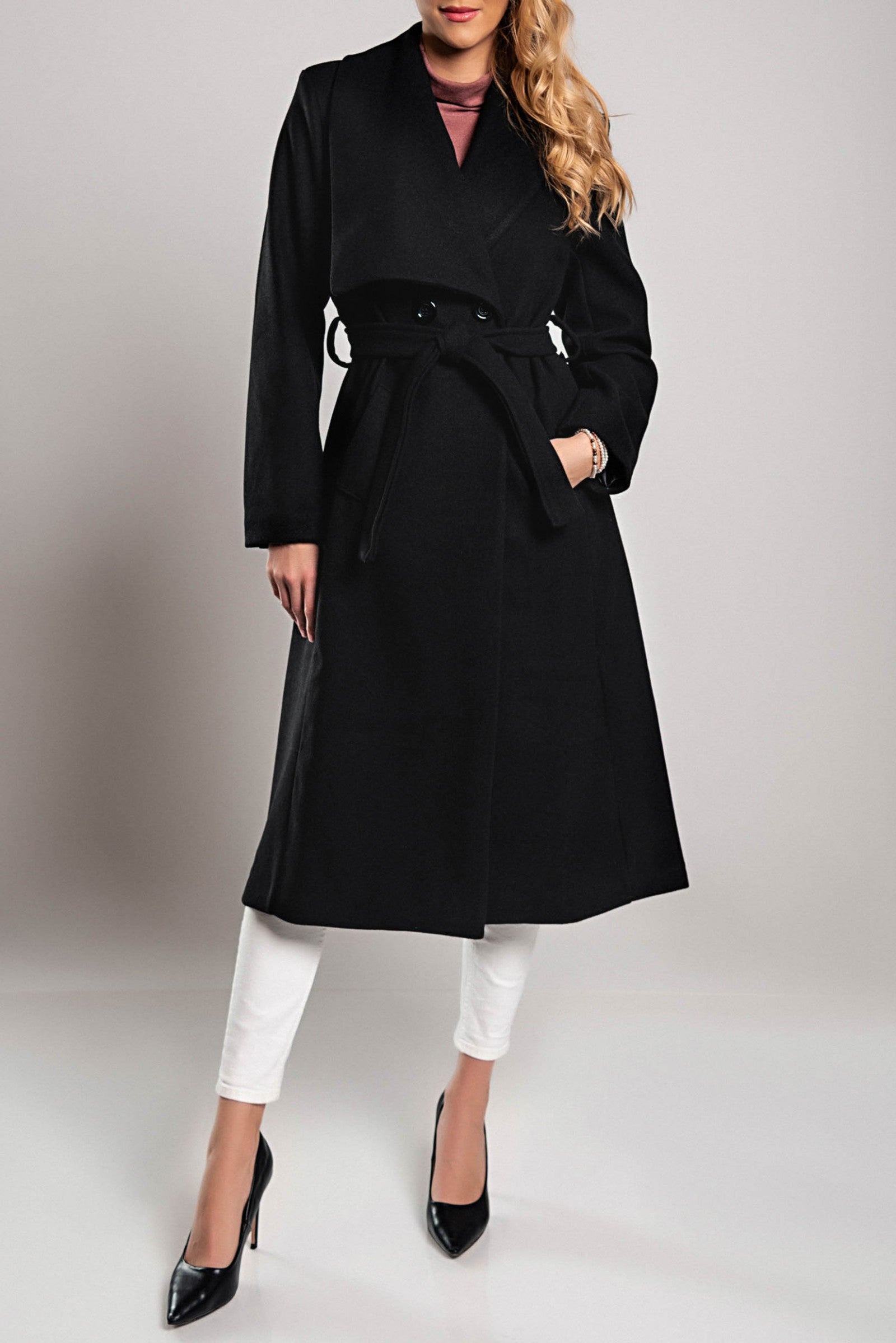 Elegant long black coat with wide collar and lapels, featuring a decorative belt and button closure.