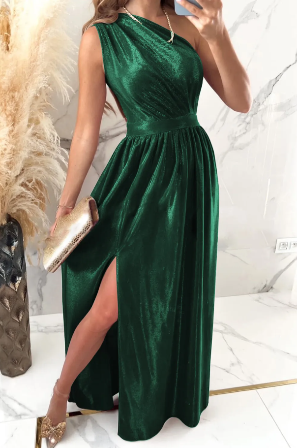 Elegant long green dress made of imitation velvet with asymmetrical neckline and slit skirt, showcasing luxurious fabric and stylish design.