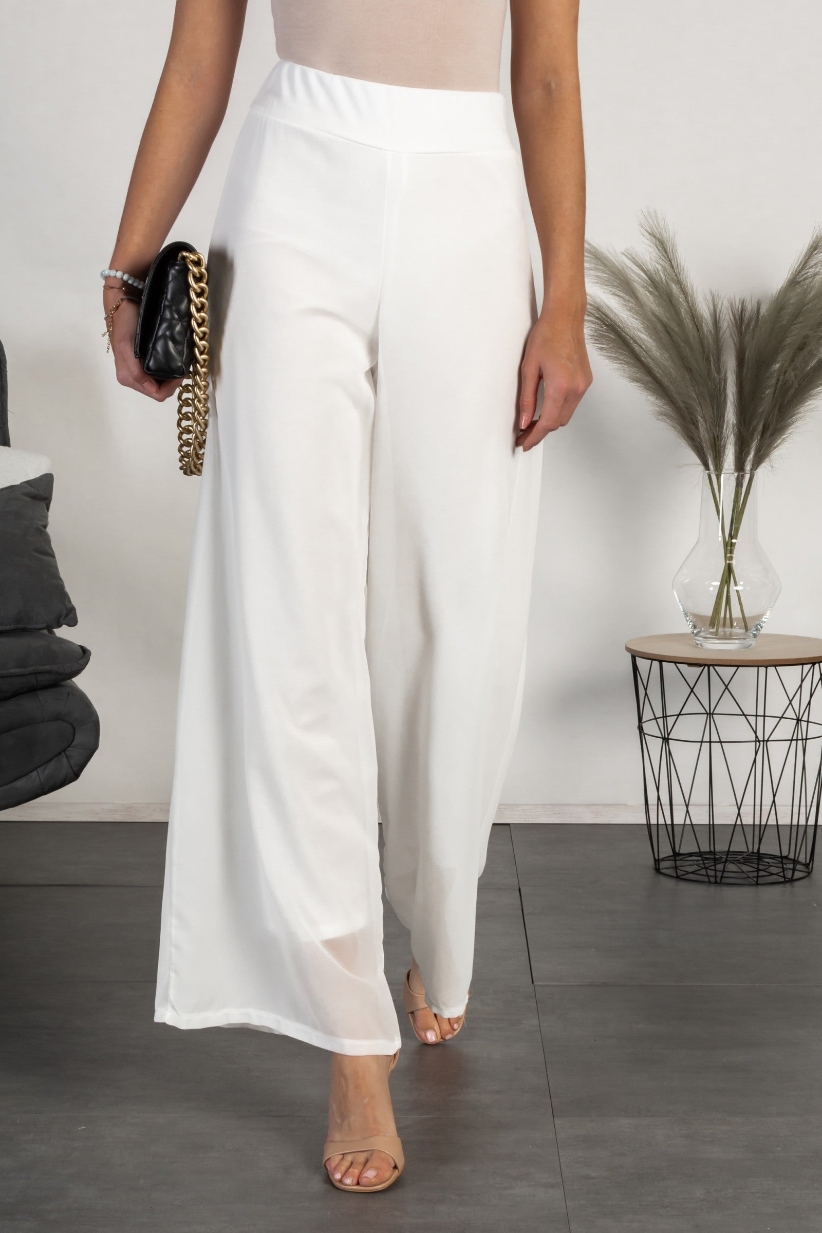 Elegant long pants Veronna in white, featuring a high waist and sheer fabric top layer, designed for comfort and style.