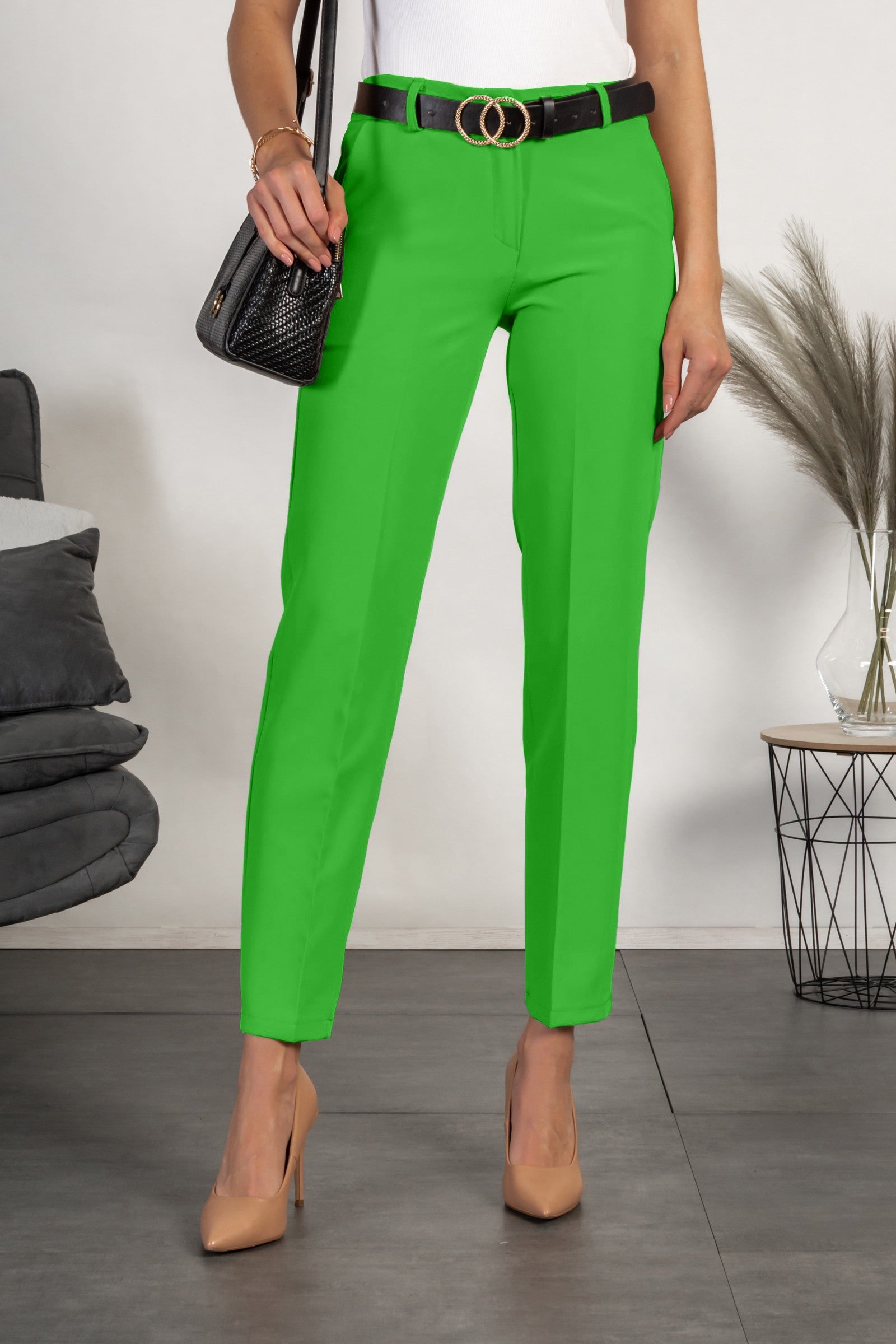 Elegant light green long trousers with straight legs, featuring side pockets and a zip and button closure, designed for comfort and style.