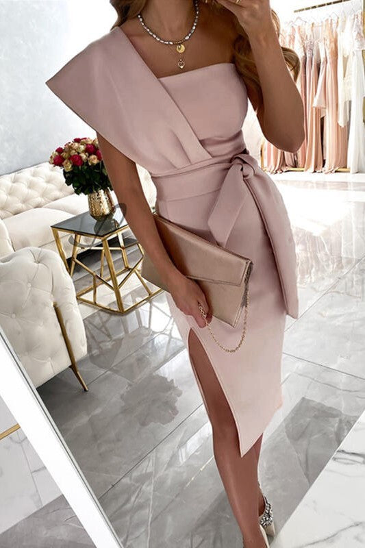 Elegant light pink midi dress Triona with asymmetrical neckline and fitted skirt, showcasing a stylish design suitable for various occasions.