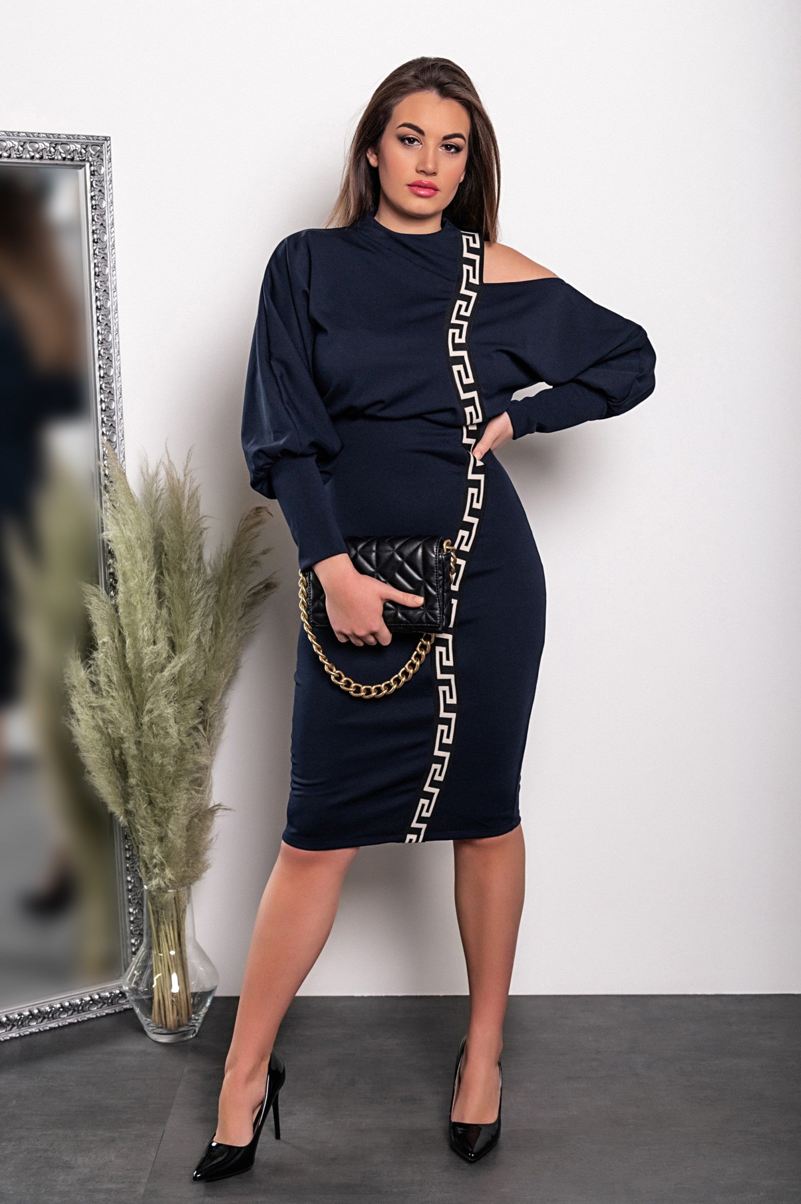 Elegant blue midi dress featuring a geometric print, off-the-shoulder design, and fitted knee-length skirt.