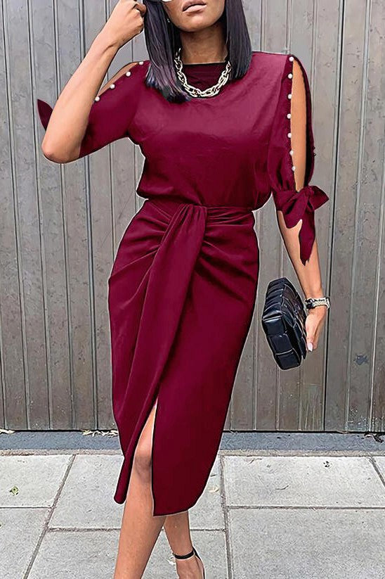 Elegant burgundy midi dress with pearl detail and 3/4 sleeves, showcasing a high-waisted gathered skirt.