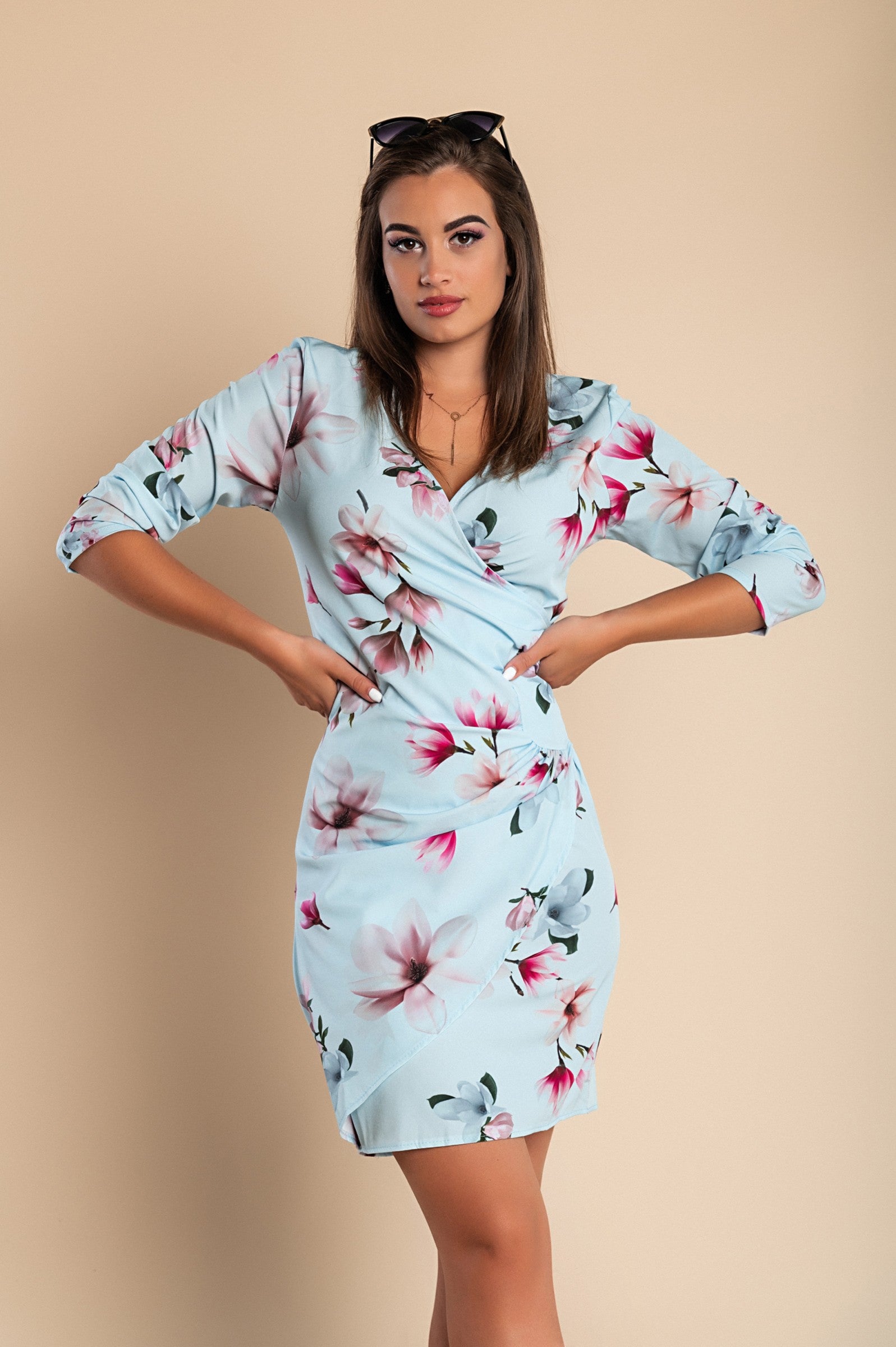 Elegant light blue midi dress with flower print and ruffles, featuring a deep V neckline and 3/4 sleeves.