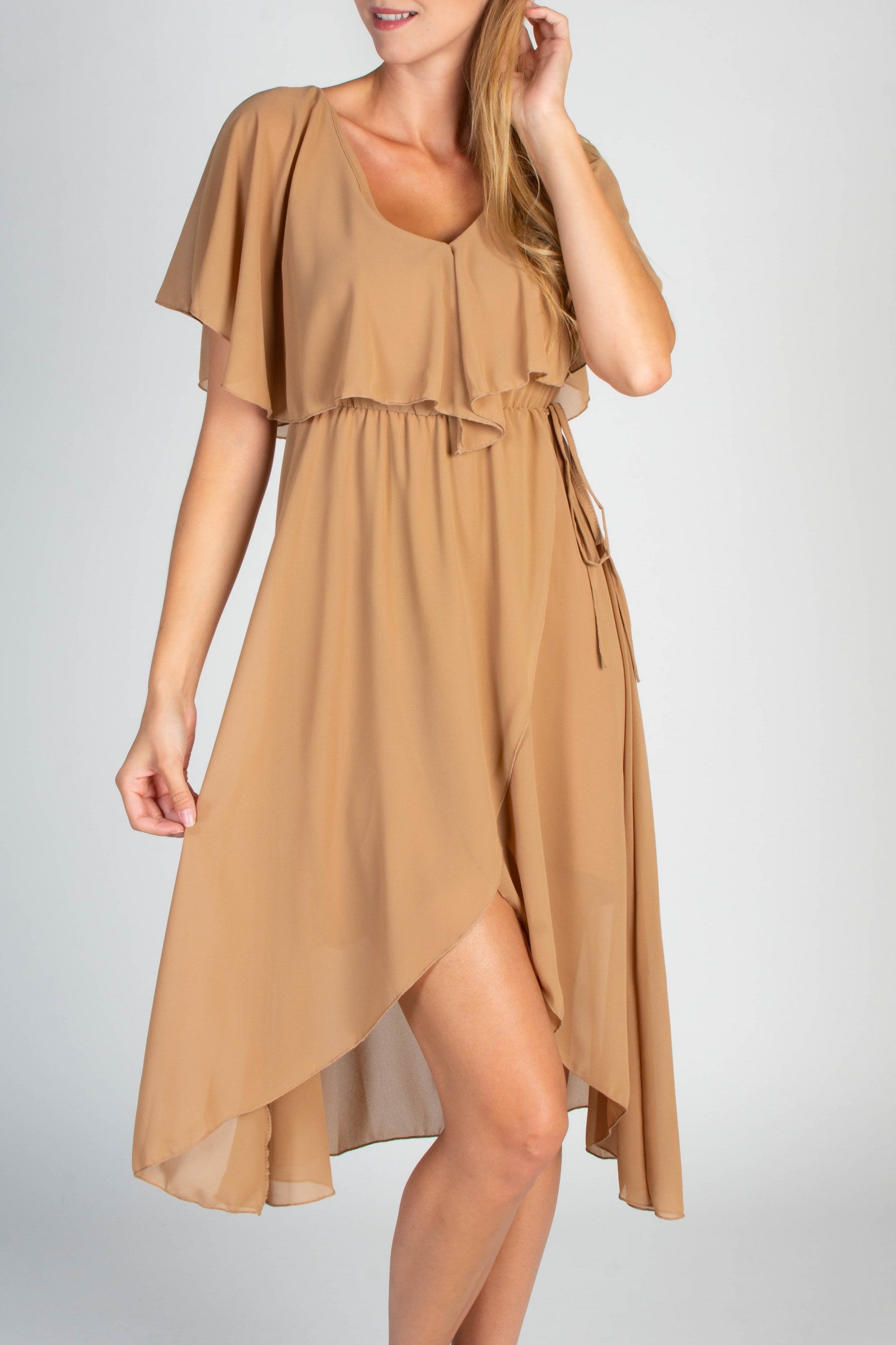 Elegant beige midi dress featuring a deep V-neckline, ruffle detail, and asymmetrical wrap skirt, made in Italy.