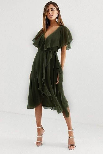 Elegant olive midi dress featuring a deep V-neckline, ruffle detail, and an asymmetric wrap skirt, designed for comfort and style.