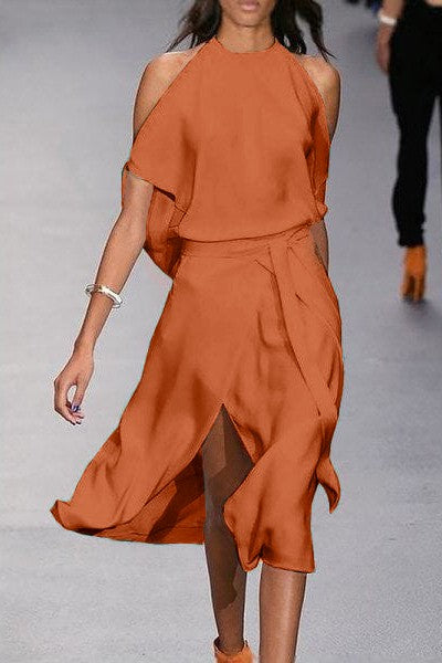 Elegant orange midi dress with shoulder slits and a wrap skirt, made of high-quality faux satin, featuring a round neckline and short sleeves.