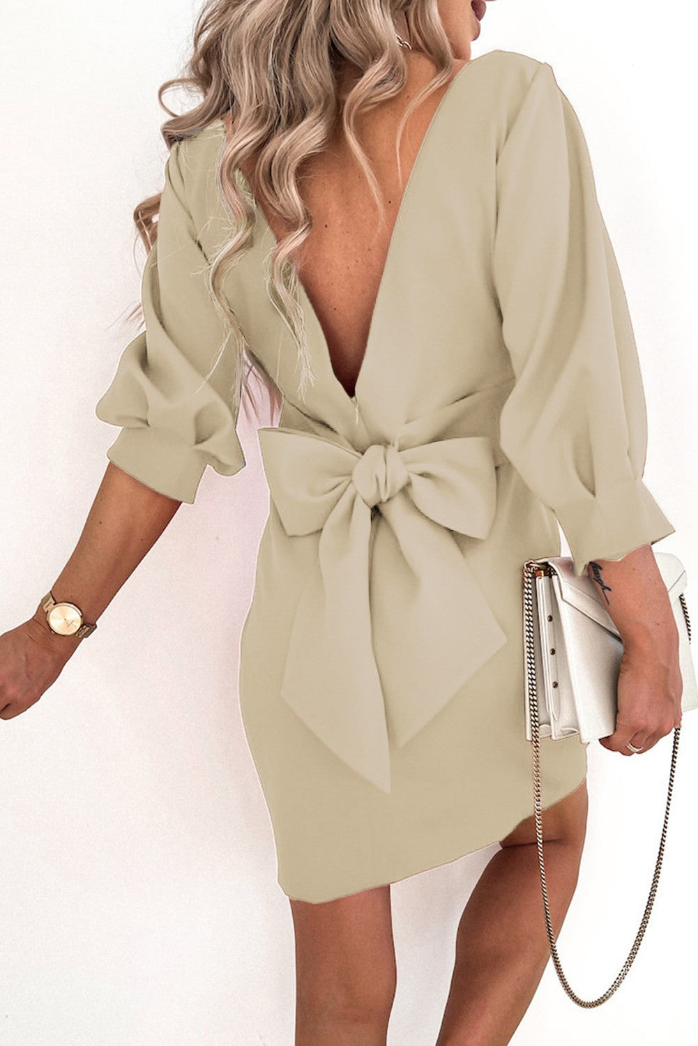 Elegant beige mini dress Varsavia with ruffles and decorative ribbons, featuring a round neckline and 3/4 sleeves.
