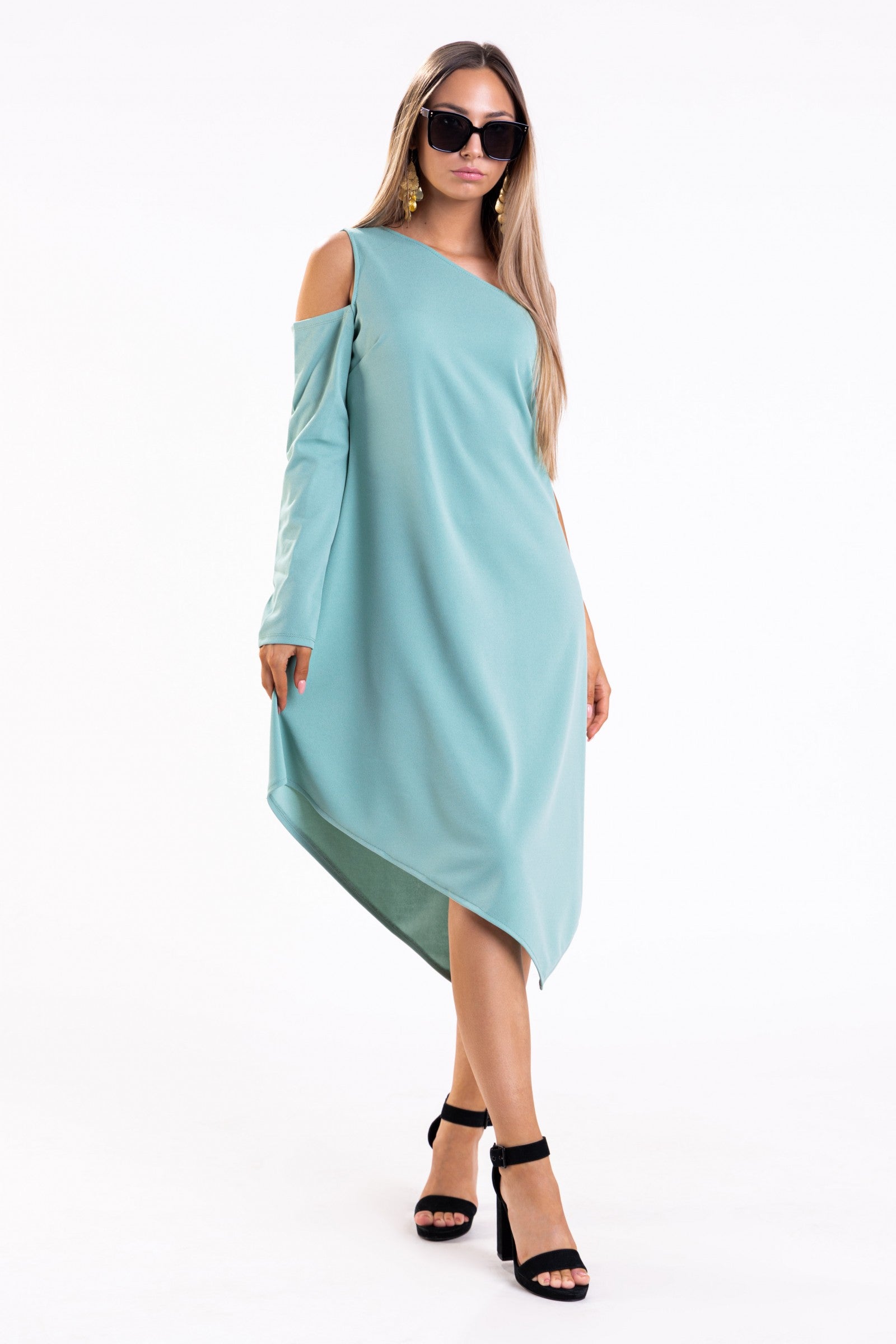 Elegant mini dress featuring an asymmetric neckline and one sleeve, made from soft stretchy fabric, perfect for various occasions.