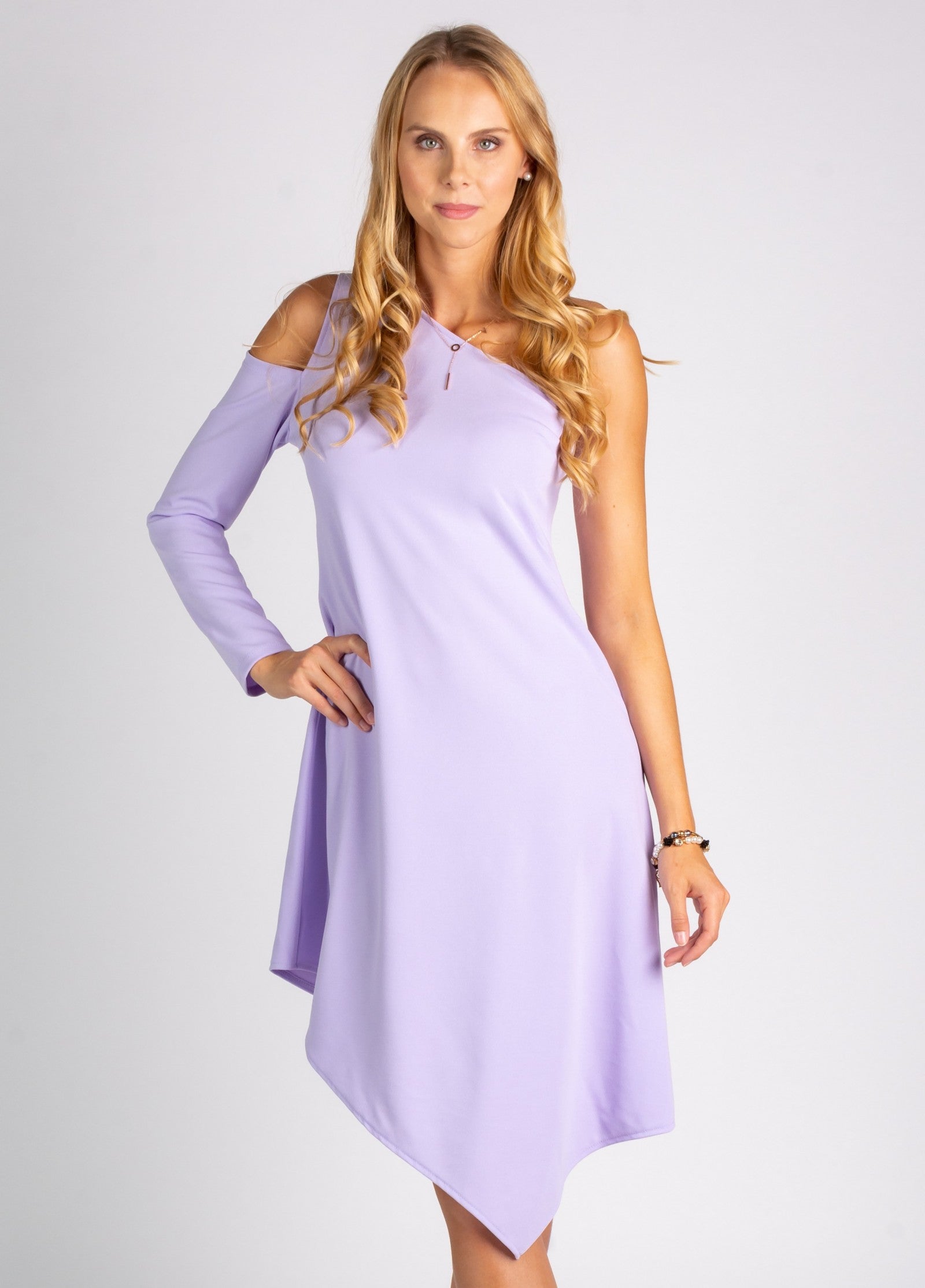 Elegant mini dress featuring an asymmetric neckline and one sleeve, made from soft stretchy fabric, perfect for various occasions.
