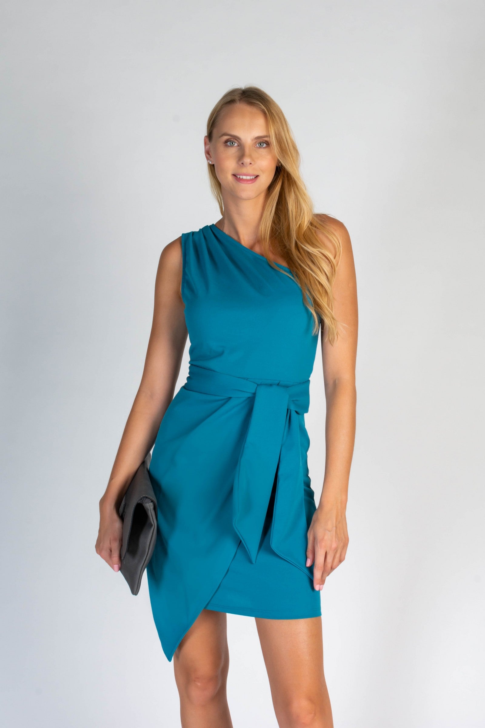Elegant petrol mini dress featuring one strap, a folding skirt, and a decorative belt, designed for comfort and style.