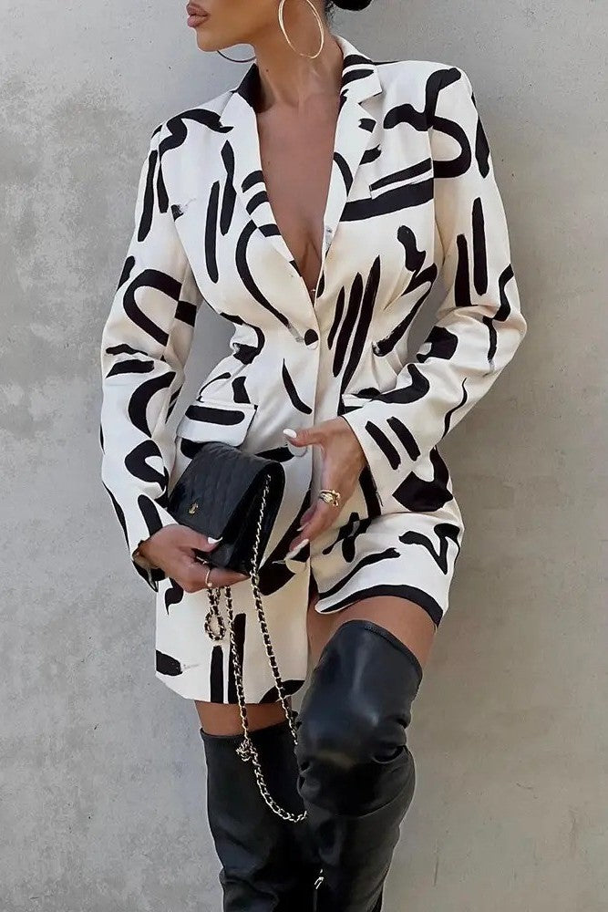 Elegant beige mini dress with print, featuring a classic collar and long sleeves, designed for comfort and style.